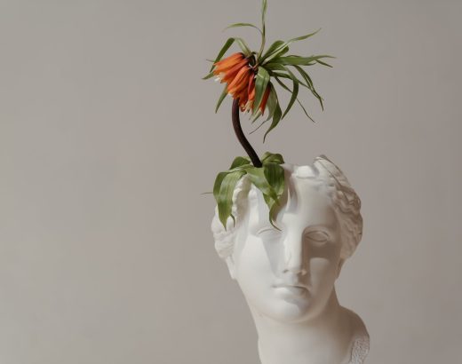 white ceramic woman with red flower